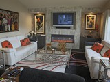 Fireplace wall with double lighted art displays & cabinets. Horizontal gas fireplace with TV Niche.