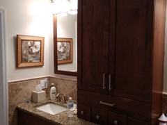 Convenient tall cabinet on vanity.